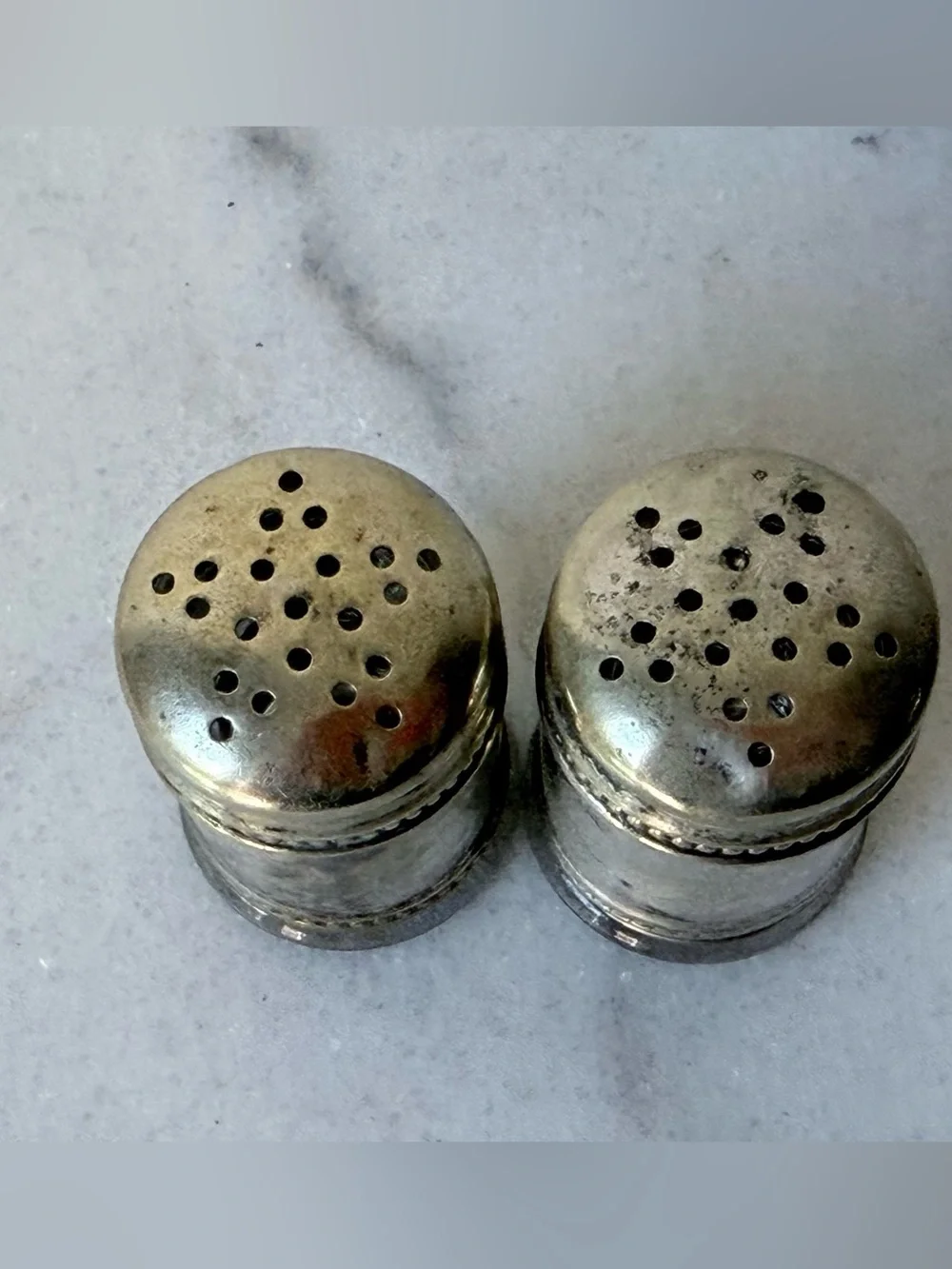 pair of antique EPNS silver salt and pepper shakers